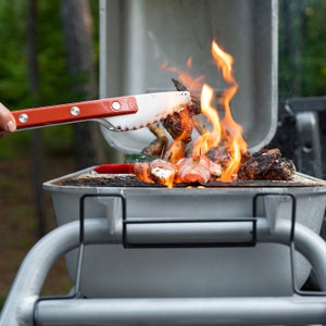 The PKGO offers a more tailgate-friendly alternative to the typical, chest-height grilling stand.