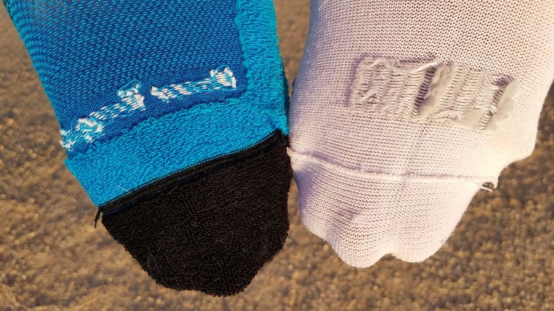 Showing the difference between a seamless link on the left and overlock seam on the right. The raised seam of the overlock can rub your toes causing hot spots.