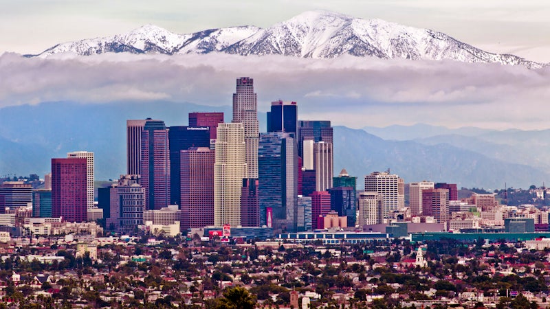 Yes, this is a real photo. The San Gabriels loom over downtown Los Angeles year round, and do accumulate enough snow most winters that you can actually ski them.