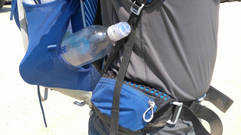 The previous-generation Exos had pockets on the hipbelt and shoulder straps. The new generation does not. Also note: To prevent your water bottle from sticking out annoyingly like in this photo, insert it cap first, then rotate the bottom of the bottle into the pocket.