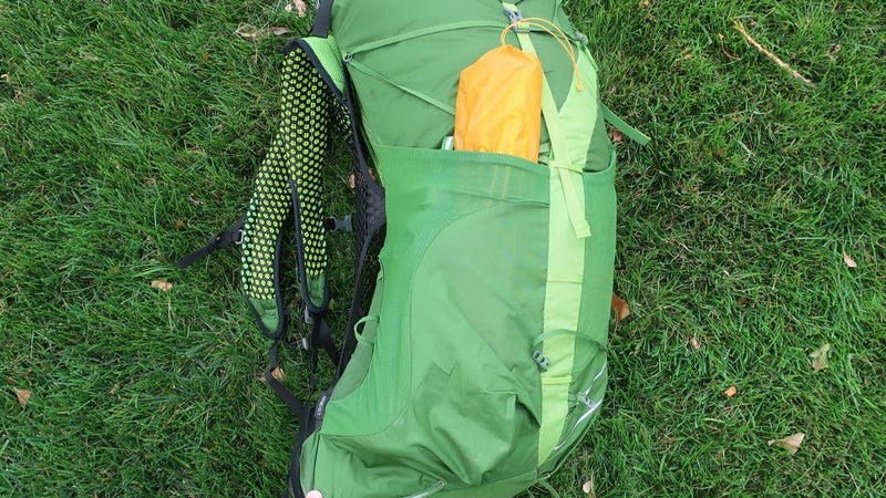 The side pockets are excellent: tall enough to hold everything secure (in this case, poles for a three-person tent and a one-liter Smartwater bottle) but accessible via the side entry.