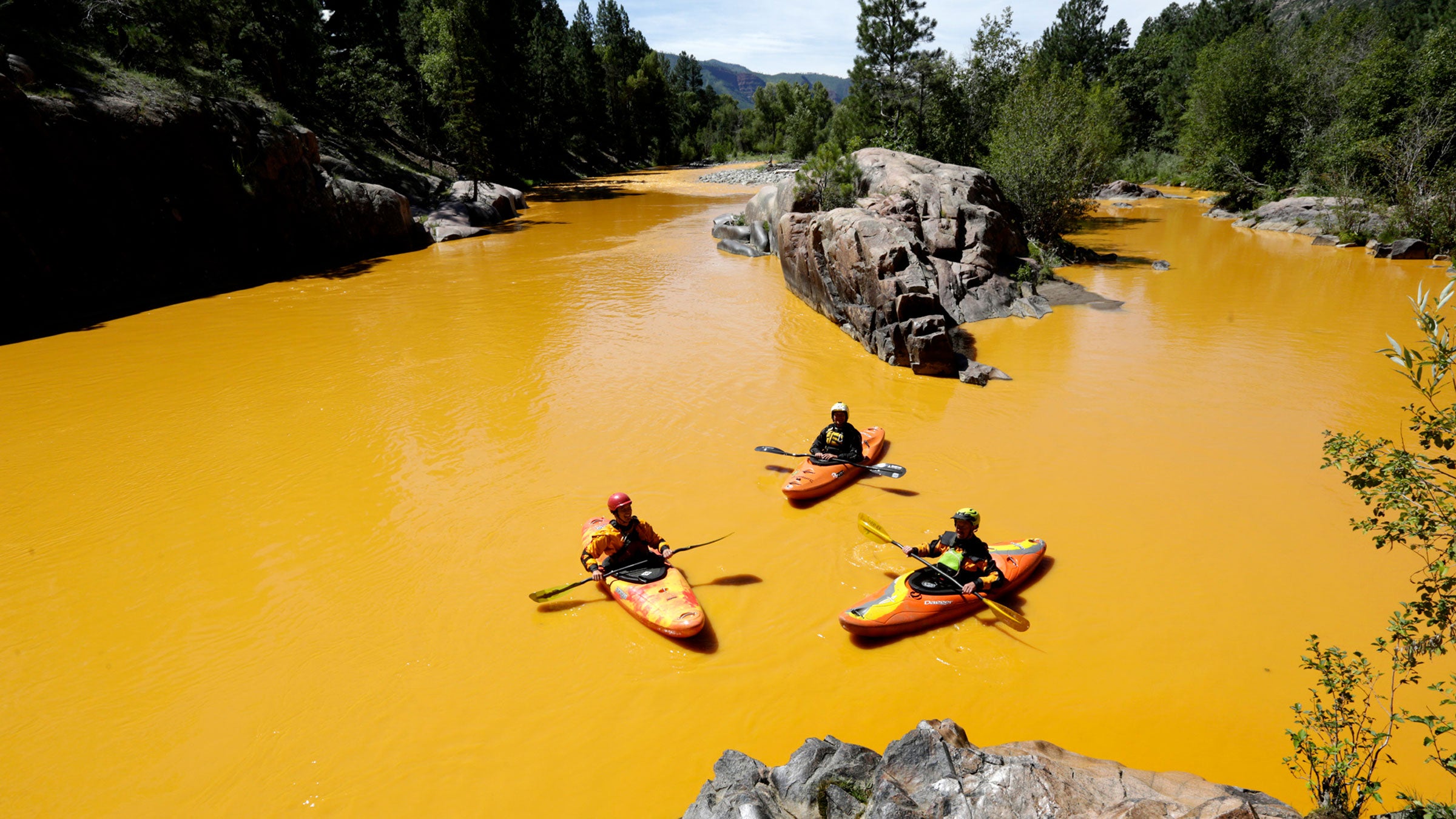 Kayakers in the polluted Animas River near Durango, Colorado after a massive mine waste spill in 2016.