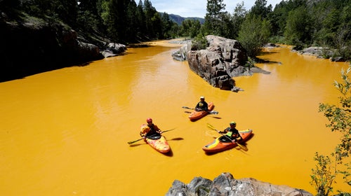 Kayakers in the polluted Animas River near Durango, Colorado after a massive mine waste spill in 2016.