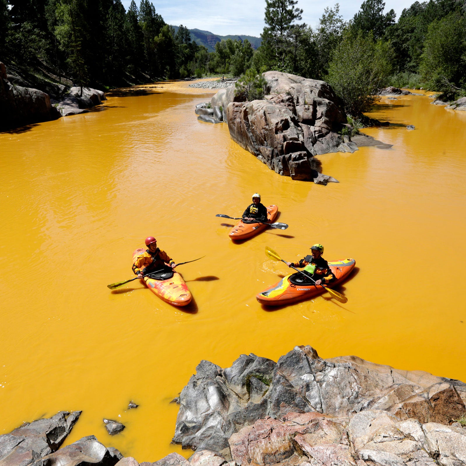 Kayakers in the polluted Animas River near Durango, CO after a massive mine waste spill in 2016.