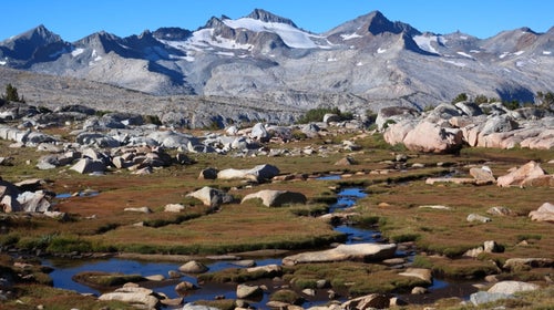 Mt. Lyell, the highest peak in Yosemite. Russell Pass, a hard Class 2 over the Cathedral Range, is the low spot on the far-right ridge, to the right of the small tower.