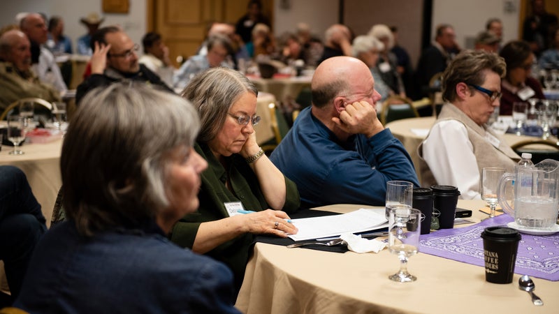 Attendees listen to Ammon Bundy's remarks at the New Code of the West event.