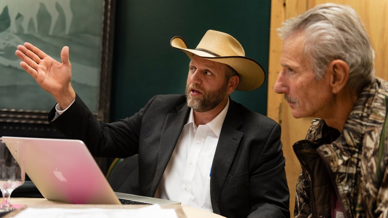 Ammon Bundy talks to a supporter at the New Code of the West conference.