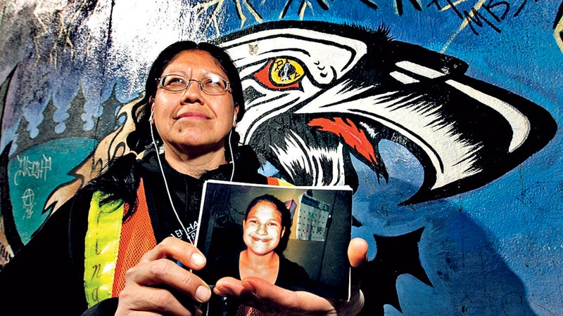 Audrey Auger-Keyesapamotoa with a photo of her missing daughter, Aielah