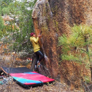 The author climbing in the Mountain Hardwear Ghost Whisperer down pants.