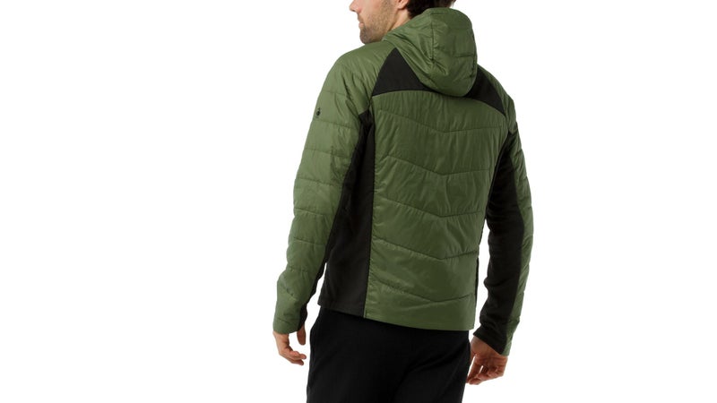 the black panels are bare, stretchy merino. They help the jacket fit closely, and maximize breathability.