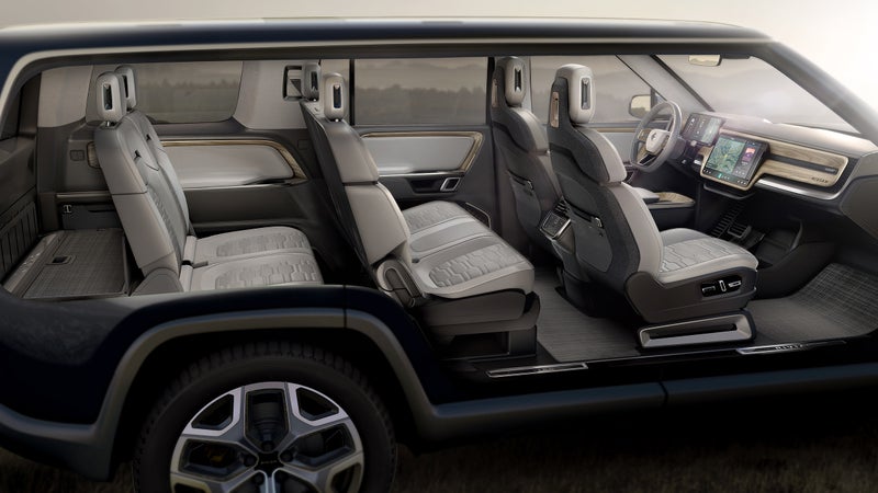 A cutaway showing the SUV's entire interior. Clean, minimal, lots of screens...this is very Tesla.
