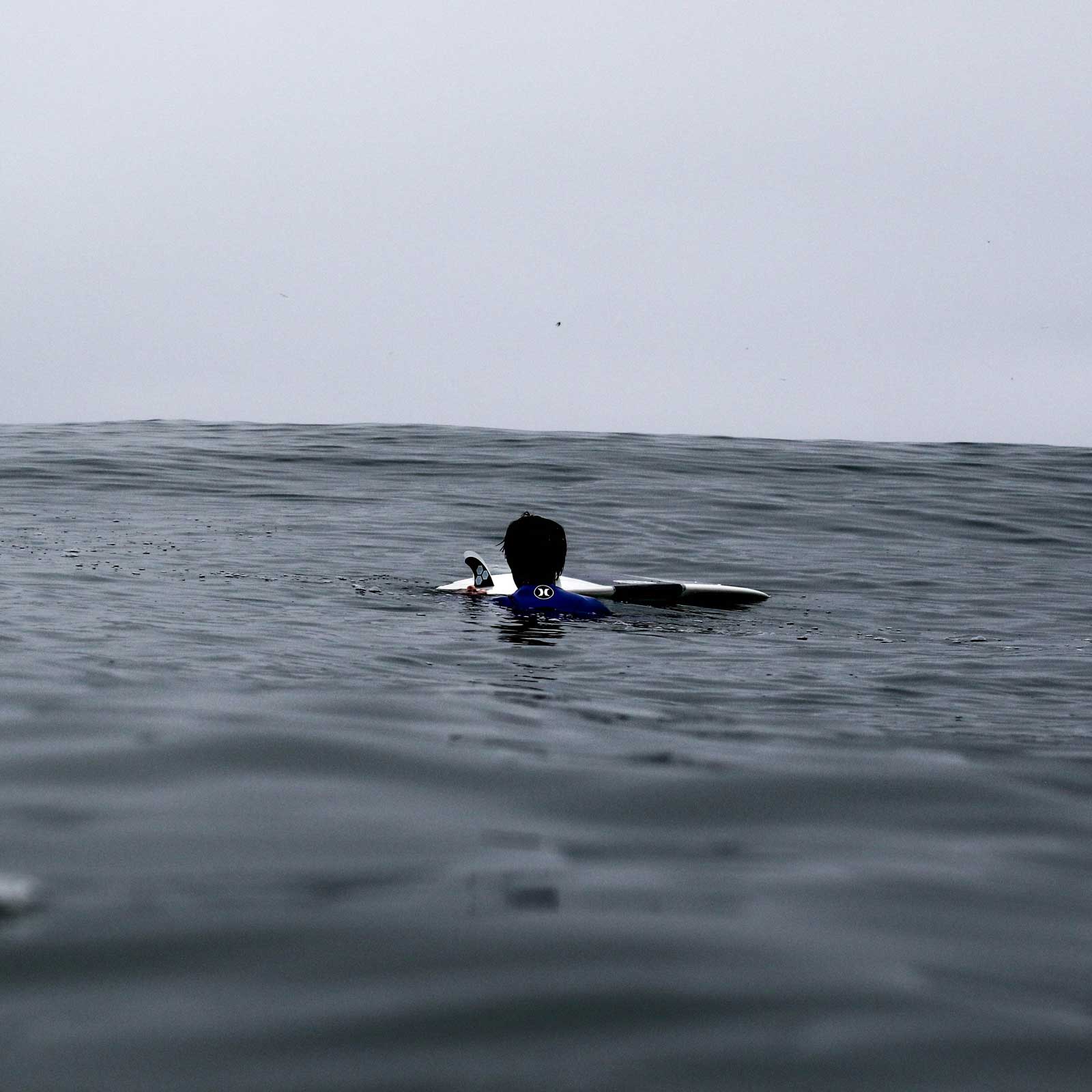 With no shore in sight, the only thing Matthew Bryce had to cling to was his surfboard and the hope that someone would find him.