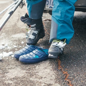 The Thermoball Traction Mule slippers are our gear guy's favorite slippers to give his feet a rest after a long day on the mountain.