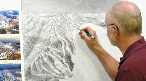 Neihus painting the trail map for Gunstock, NH.