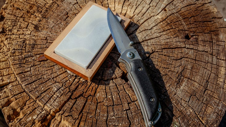 pocketknife on a wooden block how to sharpen a knife