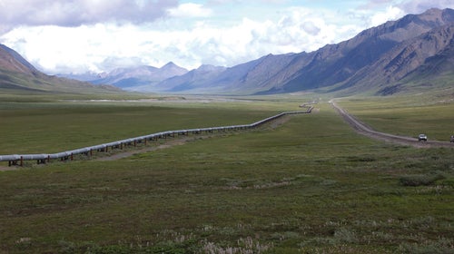 A view of the Trans-Alaska Pipeline, from the northern Brooks Range, Alaska. The rocks in the background produce oil on the North Slope.