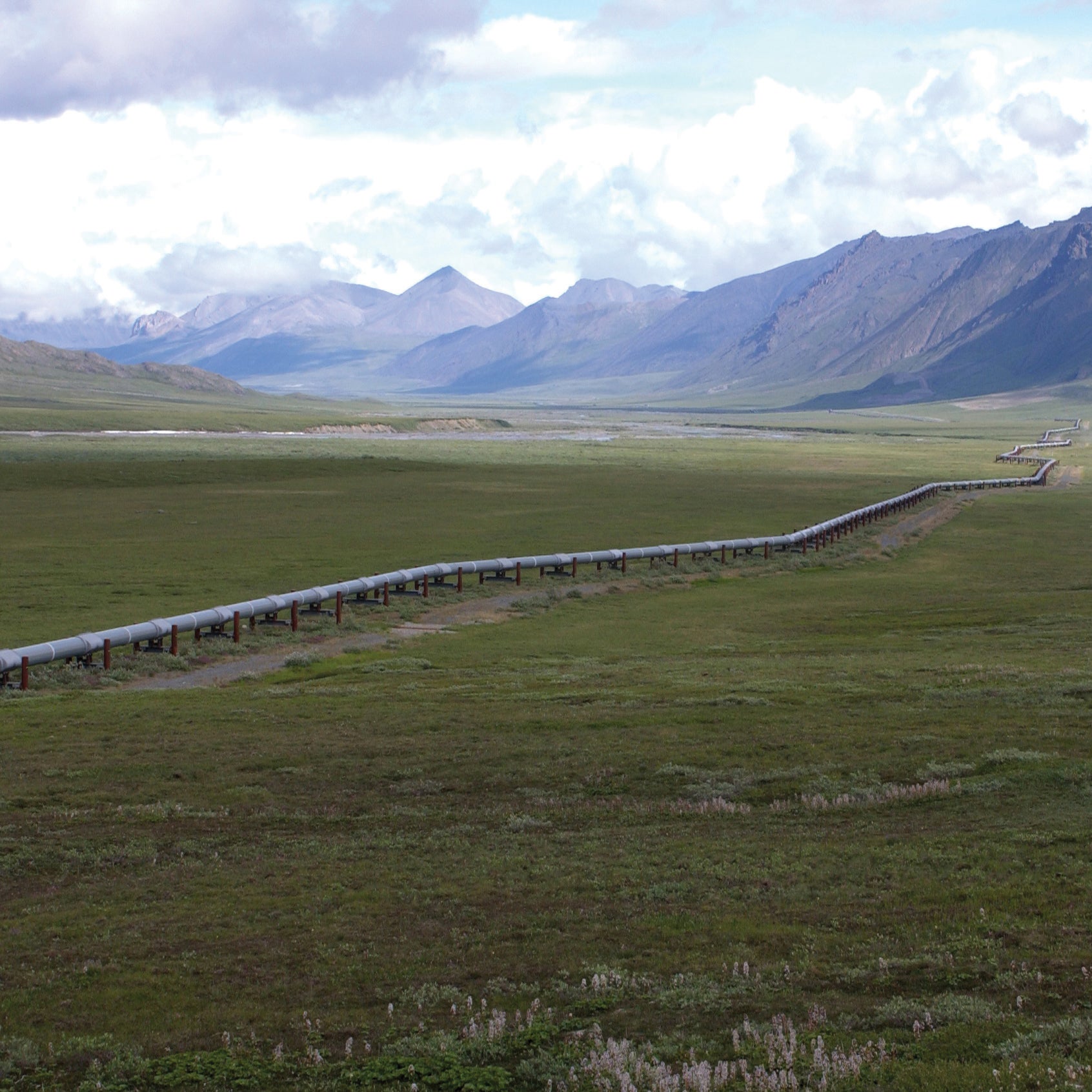 A view of the Trans-Alaska Pipeline, from the northern Brooks Range, Alaska. The rocks in the background produce oil on the North Slope.