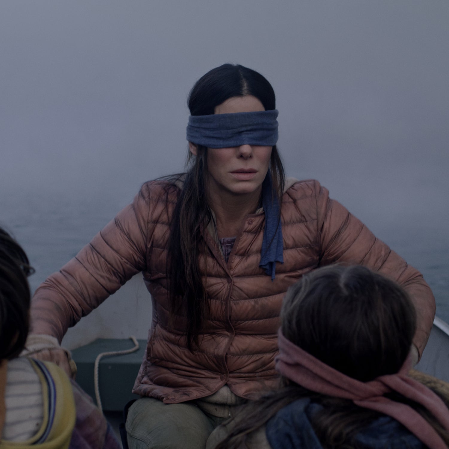 Sandra Bullock’s character, Malorie, paddles bravely in her mauve puffy jacket in 'Bird Box.'