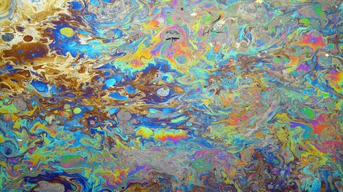 Oil pollution on water.