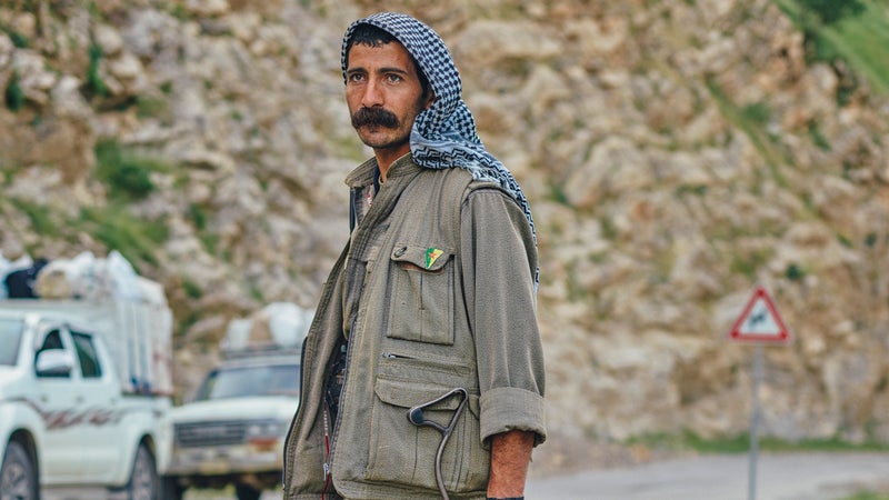 PKK guerilla Egid Serhad mans a checkpoint in Qandil.
