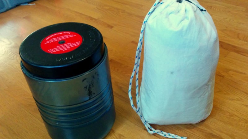 Two recommended food-storage options include hard-sided canisters like the BV500 (left) and soft-sided bear-resistant sacks like the Ursack Major (right).