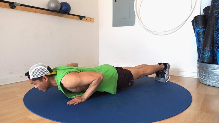 man back in low push-up position