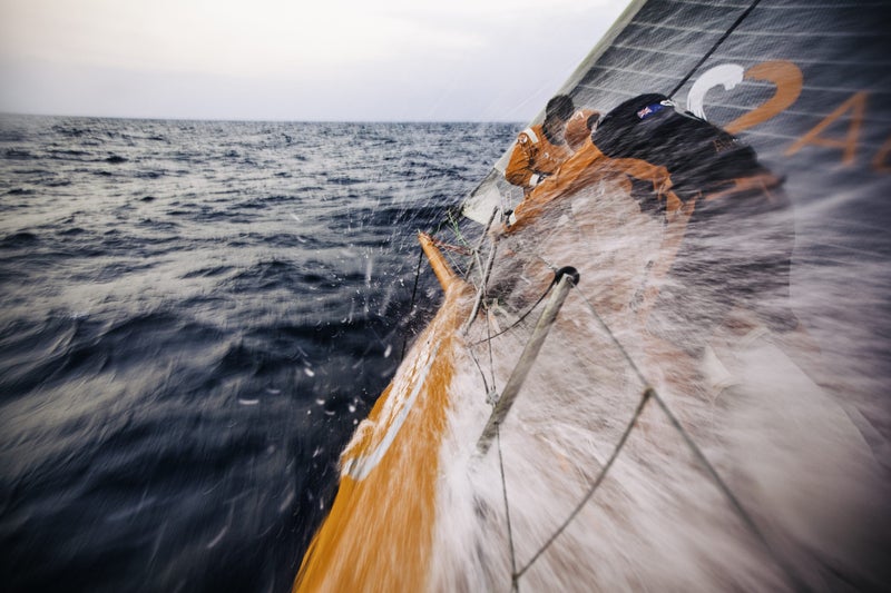 January 12, 2015: Leg three onboard Team Alvimedica. On day nine, nearing the inlet between Sri Lanka and India, winds accelerate through the gap, providing the fleet with a rare day of heavy-air sailing, a welcome change from the light winds that have dominated this leg. The bow team of Nick Dana and Dave Swete following a sail change.