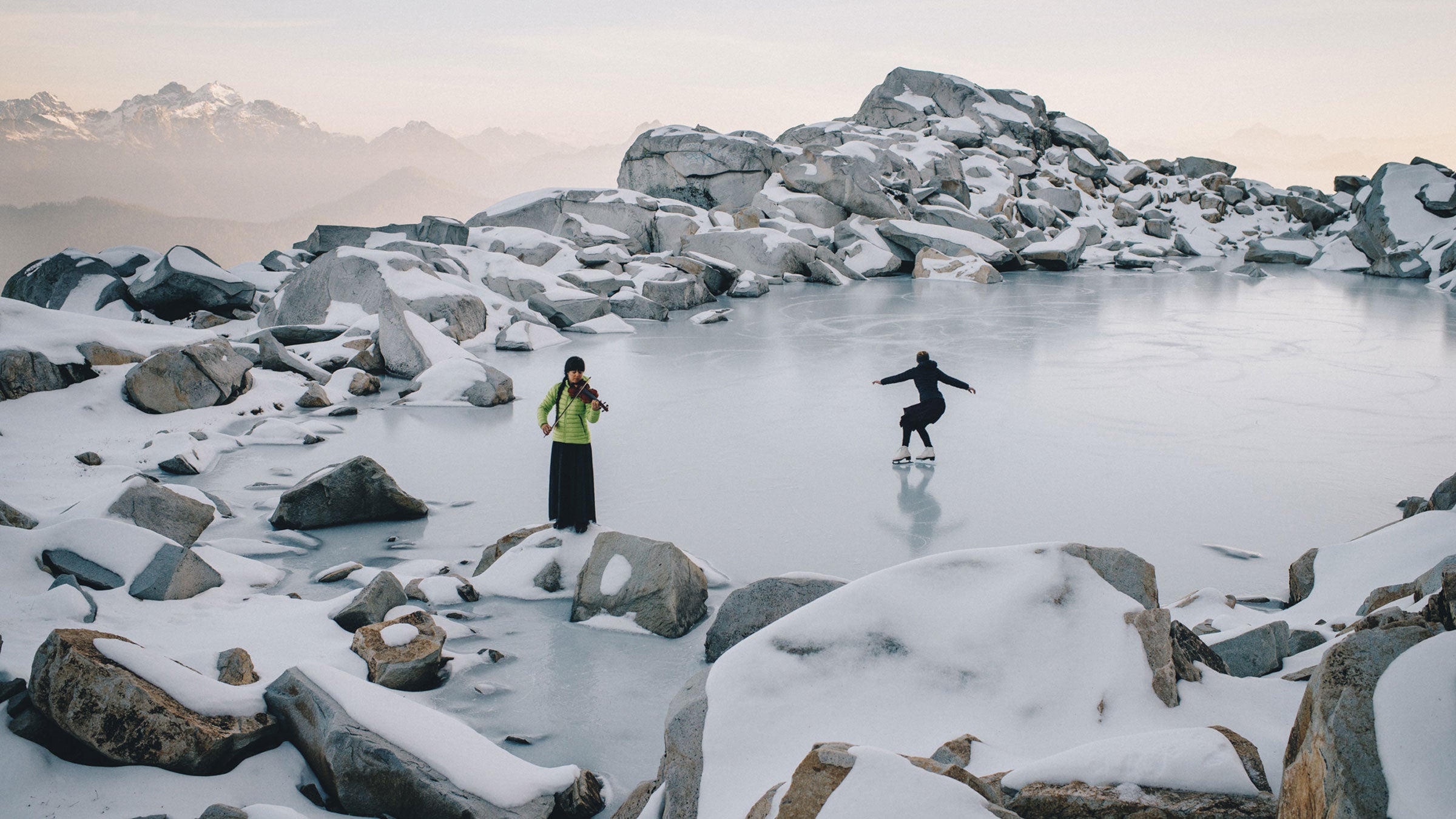 Anastasia Allison (pictured playing the violin) and Rose Freeman hike into the wilderness to play their music.