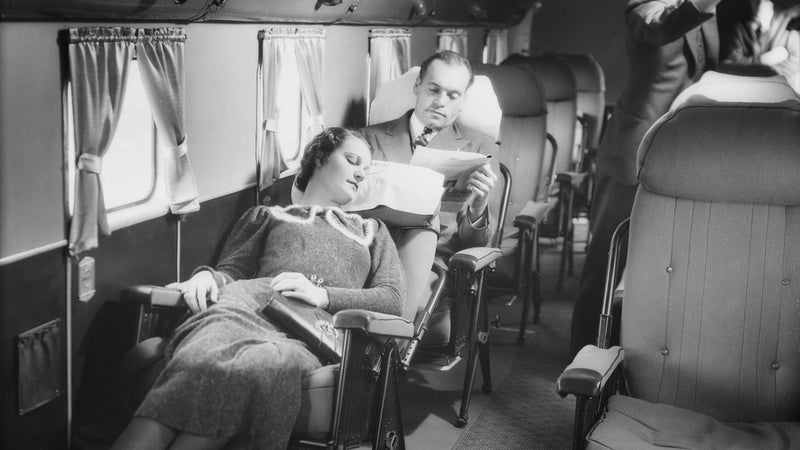 A customer reclines in the cabin of a Transcontinental and Western Air Douglas DC-1 Airplane.