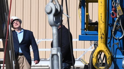 Bernhardt examines oil rig equipment in New Mexico.