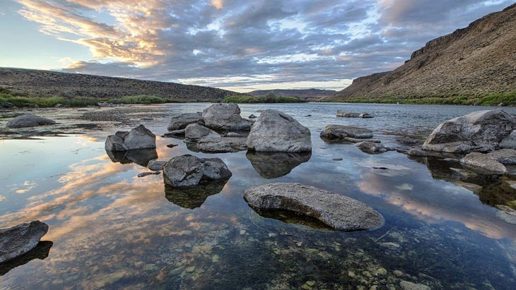 rocks on the river at dusk