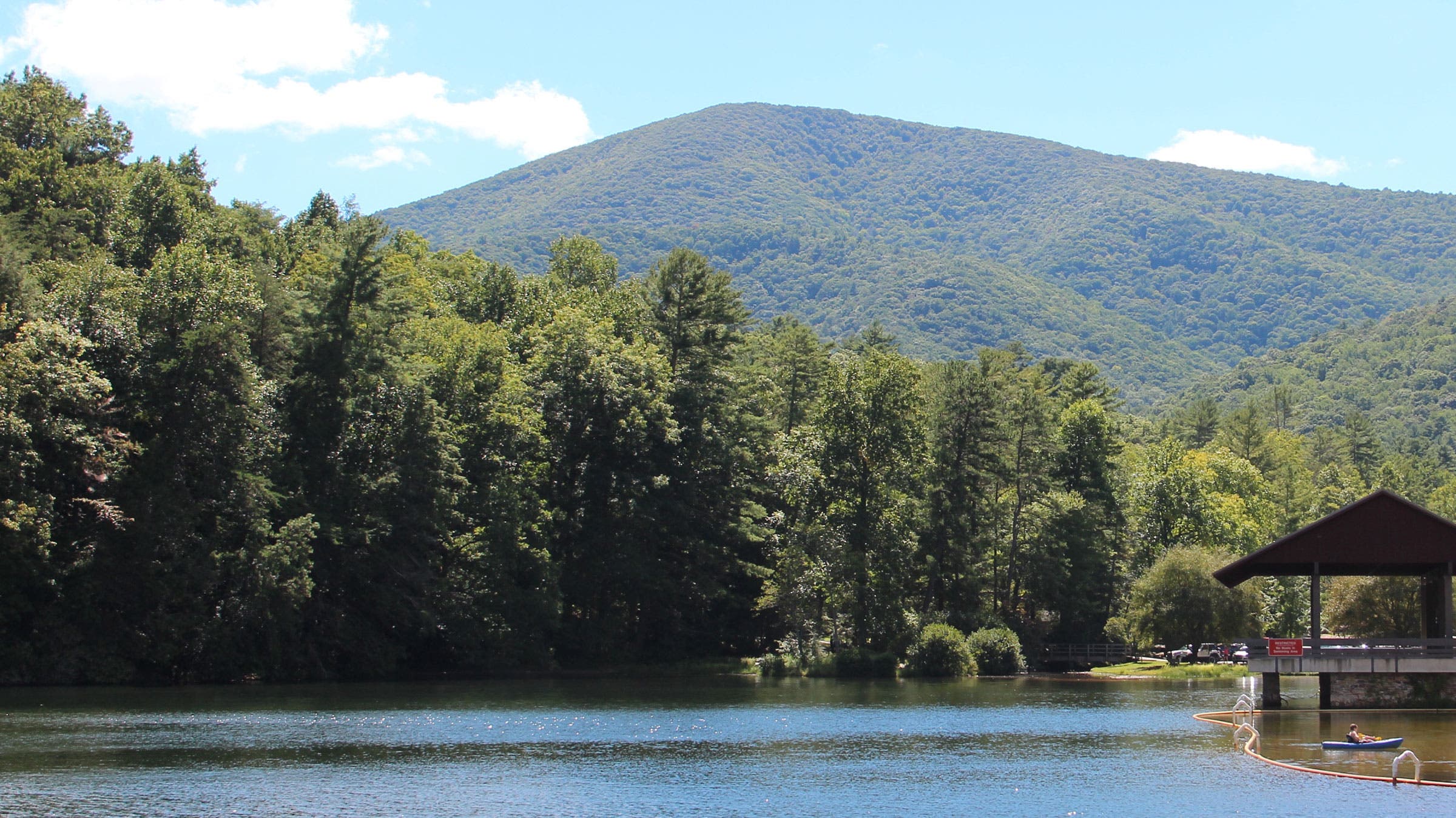 wooded mountains over a lake