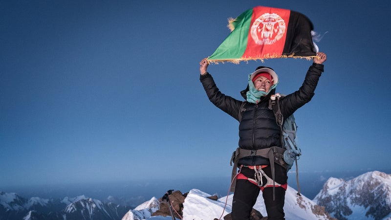“Long live the girls of Afghanistan,” Yousoufi shouts over and over again upon reaching the summit.