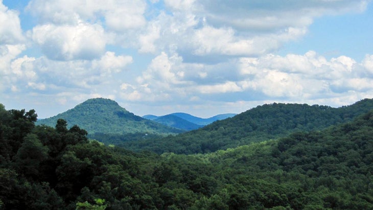 high up viewpoint looking at green and clue mountains