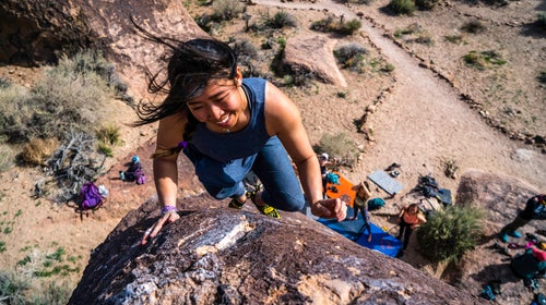 A climber topping out her route at the 2019 Women's Climbing Fest