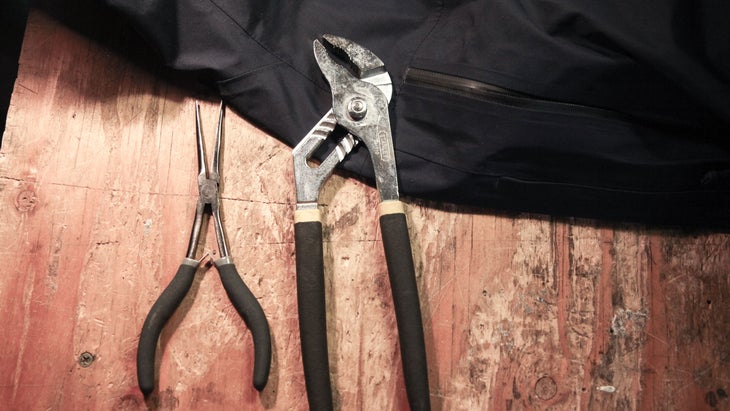 a pliers and wrench pictured