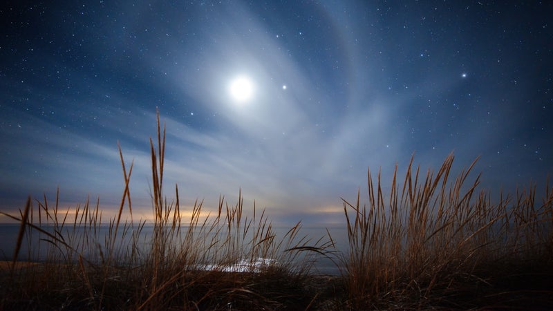 A lunar halo appears briefly over Lake Michigan near Empire.