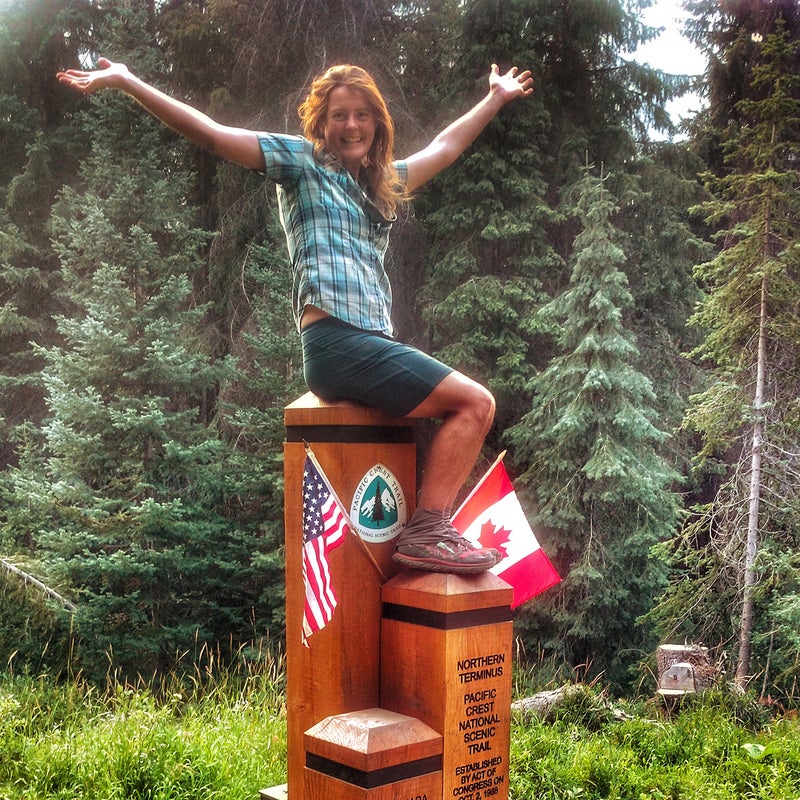 At the finish line, the US-Canada border at the terminus of the Pacific Crest Trail