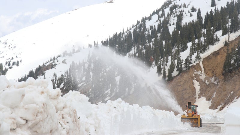 A snowblower works its way up the pass.