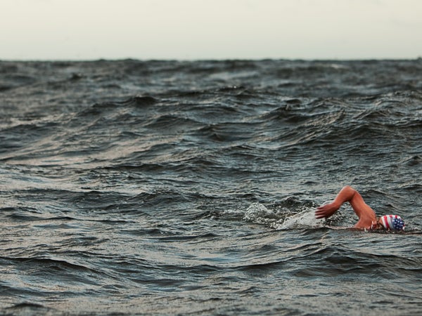 Woman swimming in the open ocean