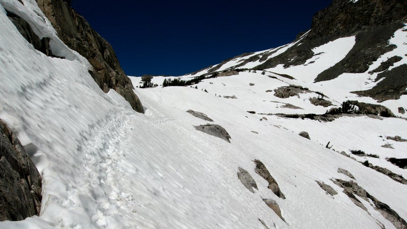 A boot track across a steep snowfield during the ascent to Muir Pass in late June of 2006