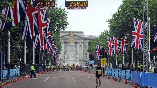 Chris Finill crosses the finish line on the Olympic 2012 Marathon Course in The Mall, London during the LOCOG Marathon Test Event in London.