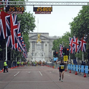 Chris Finill crosses the finish line on the Olympic 2012 Marathon Course in The Mall, London during the LOCOG Marathon Test Event in London.