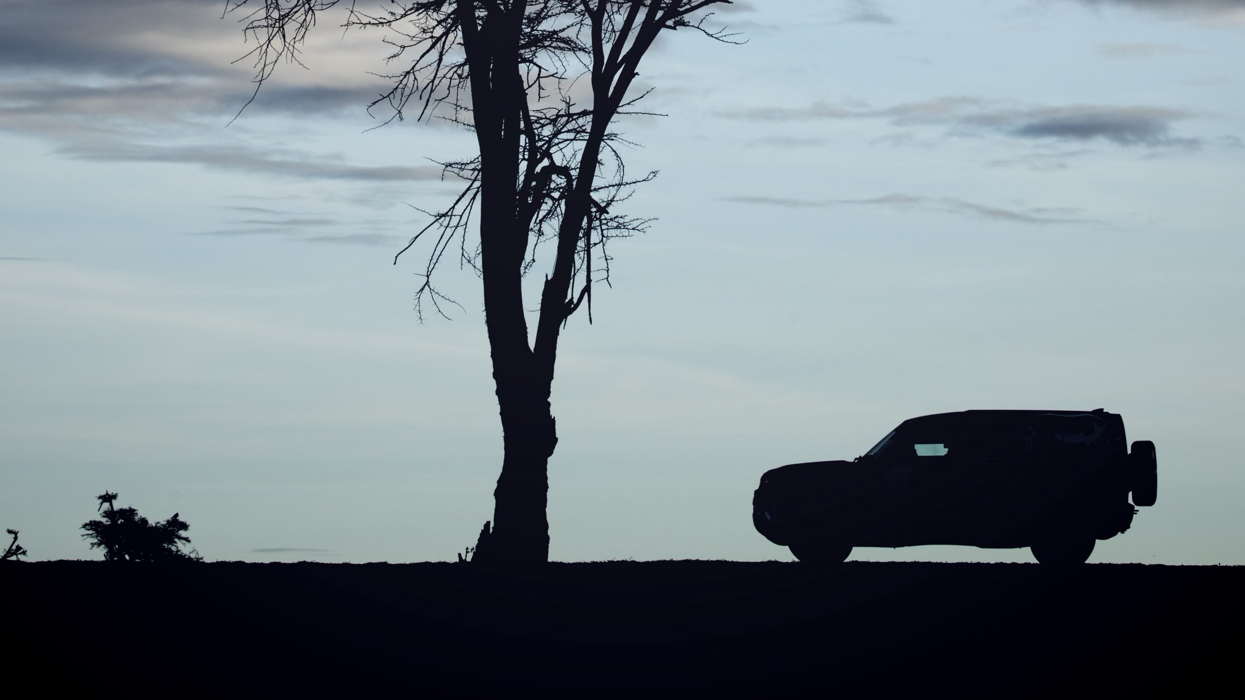 The new Defender's silhouette clearly references the iconic two-box shape of the original. 