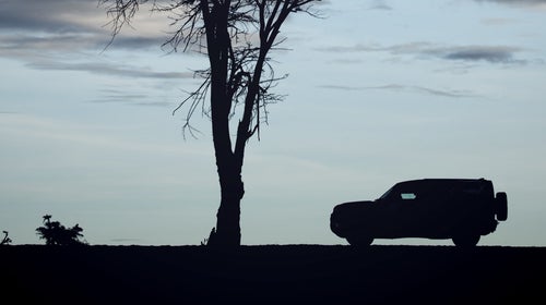 The new Defender's silhouette clearly references the iconic two-box shape of the original.