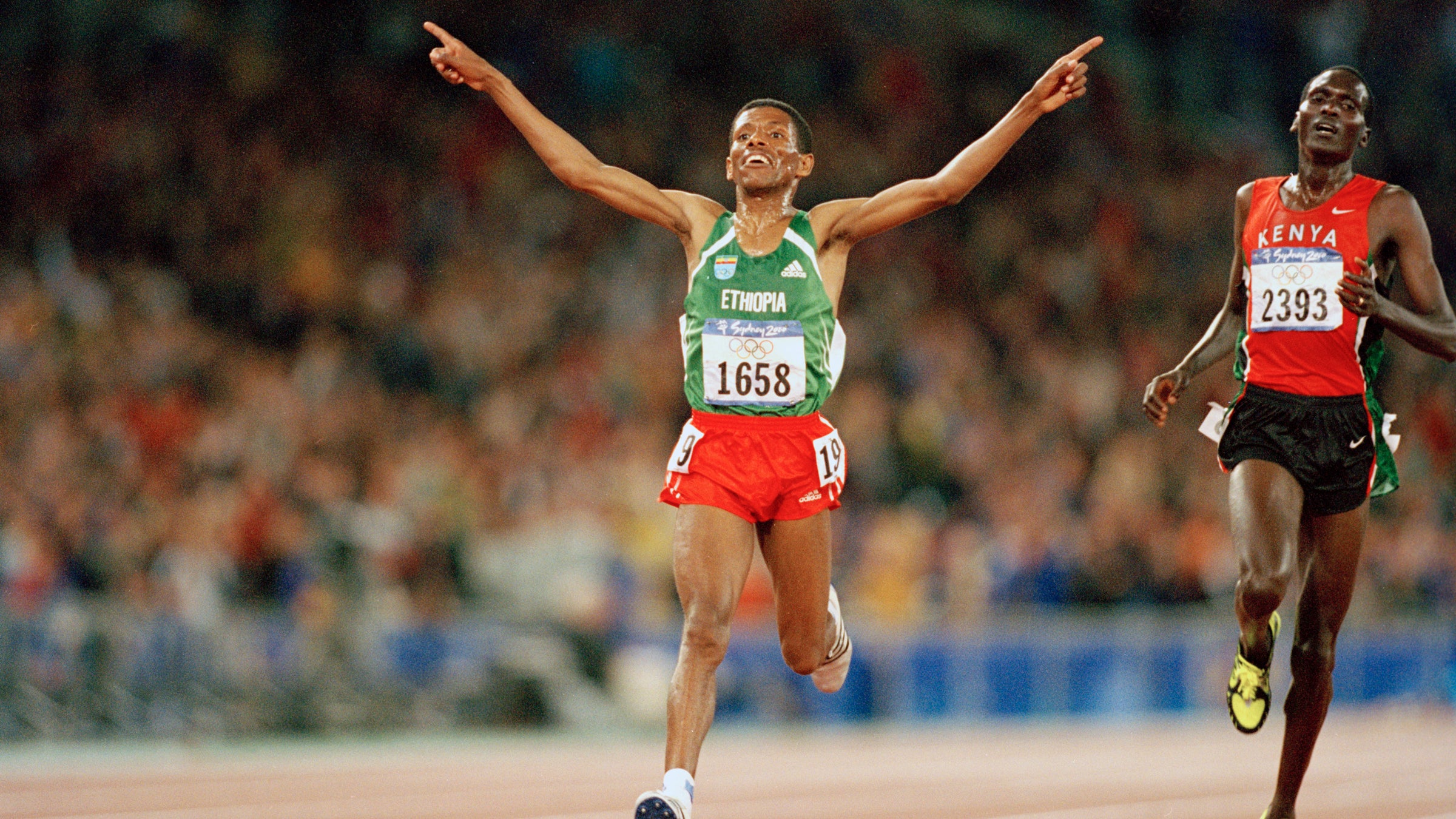 Haile Gebrselassie reaches the finish line of the 10,000 metres at the Sydney Olympics in 2000.