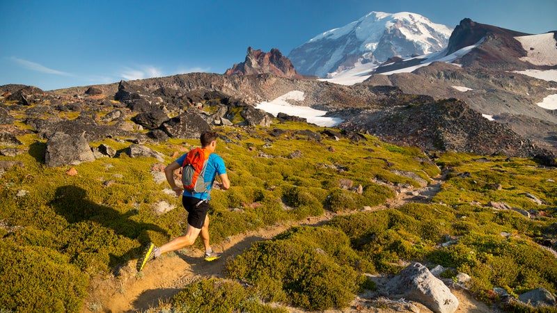 Man trail running in the mountains
