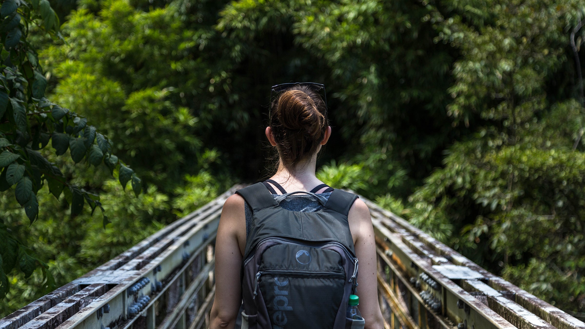 Woman on a steel bridge