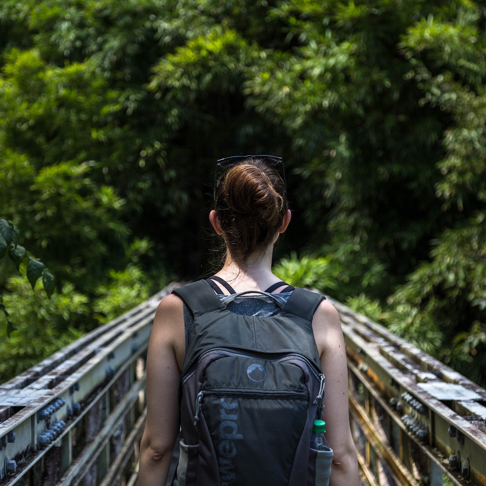 Woman on a steel bridge