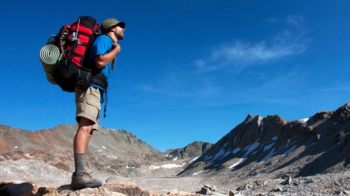 Man backpacking in the wild